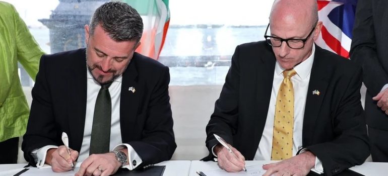 Landmark Partnership: Cruise Ireland and Cruise Britain Join Forces to Boost Cruise Tourism  - Conor Mowlds Chair Cruise Ireland (L) and Ian McQuade, Chair, Cruise Britain (R) sign MoU at Seatrade Cruise Global (Image at LateCruiseNews.com - April 2024)  (Image at LateCruiseNews.com - April 2024)